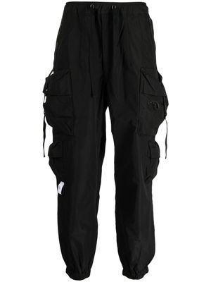 Musium Div. multiple-pocket drop-crotch trousers - Black
