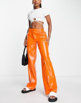 NA-KD x Melissa Bentsen faux leather wide leg pants in orange