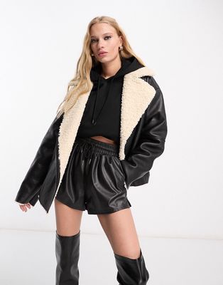 NA-KD x Mimi AR faux leather aviator jacket with faux fur in black