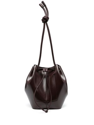 Nanushka Elongated knot-detail bucket bag - Brown