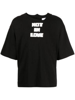 Natasha Zinko slogan-print asymmetric cotton T-shirt - Black