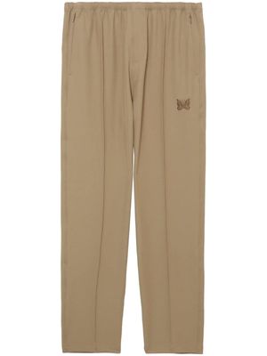 Needles logo-embroidered pressed-crease tapered trousers - Neutrals
