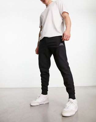New Balance Essentials embroidered sweatpants in black