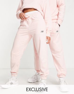 New Balance Unisex logo sweatpants in pink - part of a set