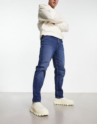 New Look tapered jeans in dark wash blue