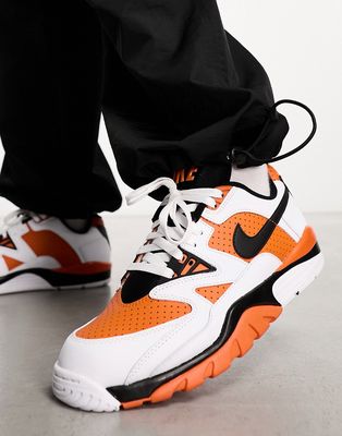 Nike Air Cross Low sneakers in white & orange