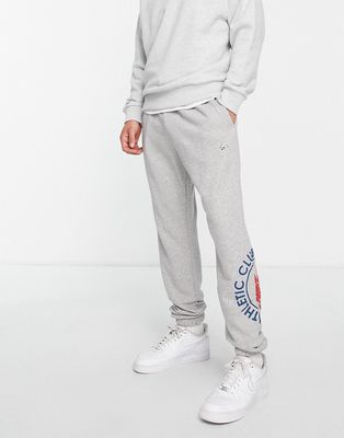 Nike Athletic Club retro logo casual fit cuffed sweatpants in gray heather