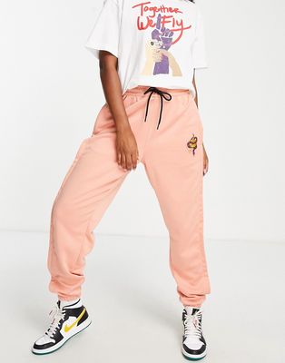 Nike Basketball Dri-FIT Retro Fly polyknit track pants in pink