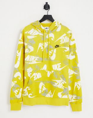 Nike Club Fleece all over logo print hoodie in yellow