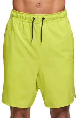 Nike Dri-FIT Unlimited 7-Inch Unlined Athletic Shorts in Bright Cactus/Black