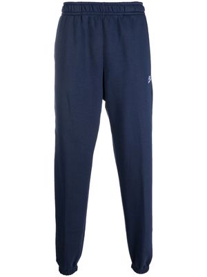 Nike logo-embroidered cotton track pants - Blue