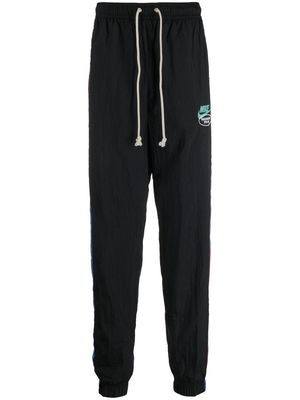 Nike NSW woven unlined tracksuit trousers - Black