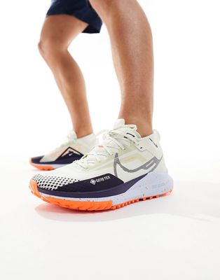 Nike Pegasus Trail 4 sneakers in cream and orange-White