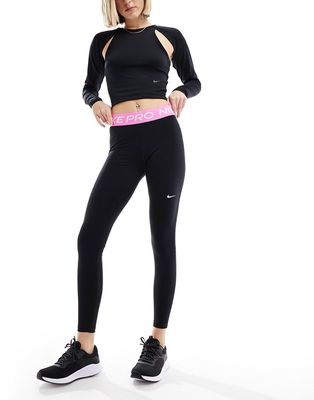 Nike Pro training leggings in black with pink detail