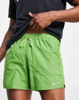 Nike Running Dri-FIT Stride 5-Inch brief-lined shorts in green