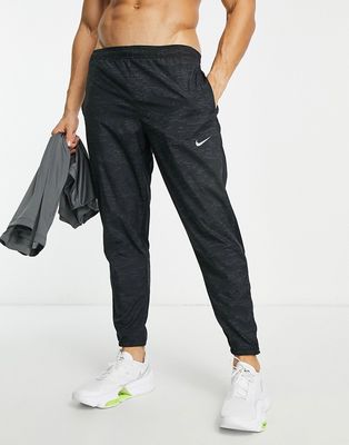 Nike Running Dri-FIT sweatpants in black