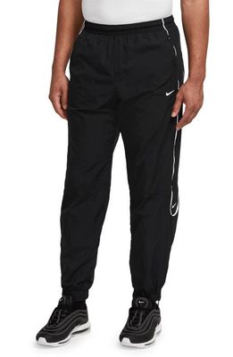 Nike Solo Swoosh Water Repellent Track Pants in Black/White