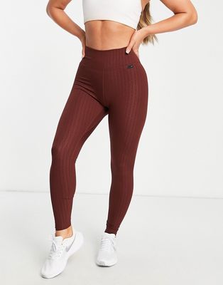 Nike Training Dri-FIT One Luxe mid-rise all over geo print leggings in brown