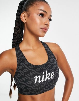 Nike Training Icon Clash Dri-FIT Swoosh all-over print GX graphic medium support sports bra in black