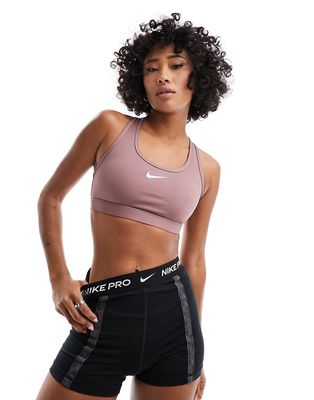 Nike Training mini swoosh medium support sports bra in smokey mauve-Neutral