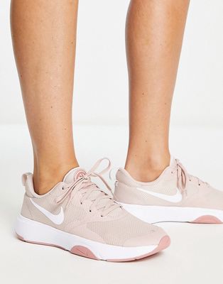 Nike Training Renew City Rep sneakers in pink and white