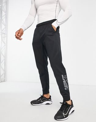 Nike Training Therma-FIT Swoosh tapered sweatpants in black