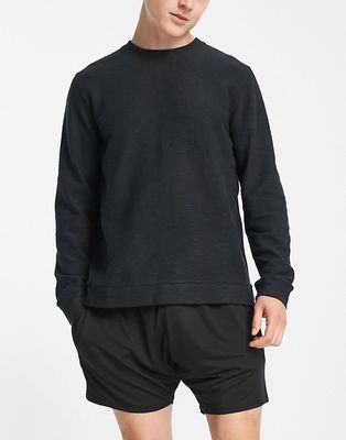 Nike Yoga Dri-FIT Essential Fleece crew neck sweatshirt in black