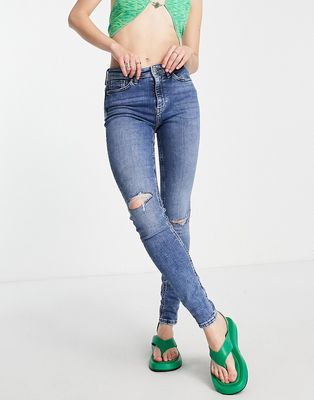 Only high rise skinny jean with distressing in mid blue