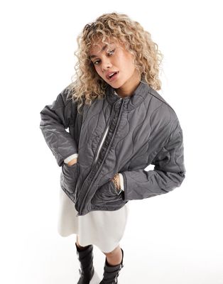 Only onion quilted jacket with oversized pockets in washed gray