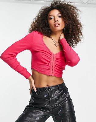 Only ribbed clasp detail cropped long sleeve top in pink