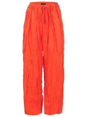 Osklen crinkle-effect trousers - Orange