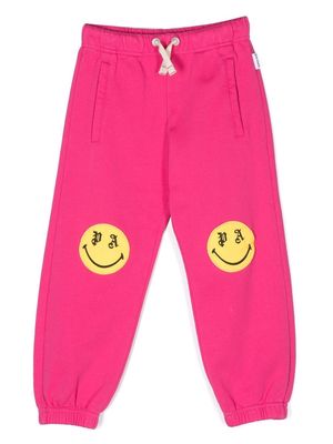 Palm Angels Kids smiley-print track pants - Pink