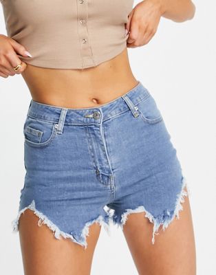 Parisian distressed denim shorts with rips in mid blue