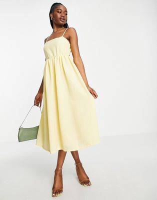 Pieces Premium textured open back midi dress in pale yellow