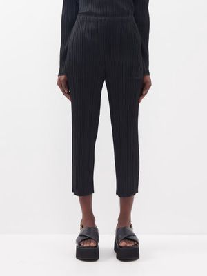Pleats Please Issey Miyake - Cropped Technical-pleated Knit Trousers - Womens - Black