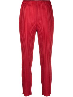 Pleats Please Issey Miyake pleated cropped straight-leg trousers - Red