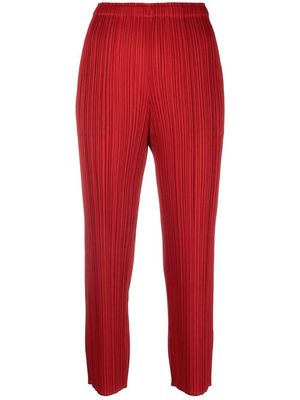 Pleats Please Issey Miyake plissé cropped trousers - Red