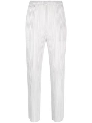 Pleats Please Issey Miyake plissé tapered-leg cropped trousers - Grey