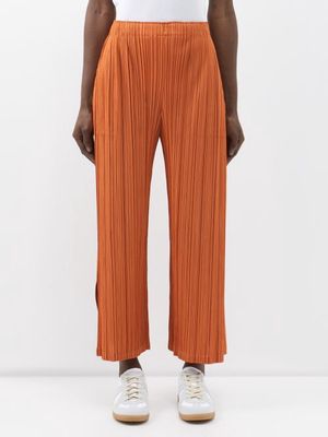 Pleats Please Issey Miyake - Side-slit Technical-pleated Trousers - Womens - Orange