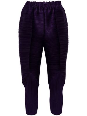 Pleats Please Issey Miyake tapered pleated trousers - Purple