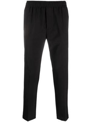 PMD logo-patch tapered trousers - Black