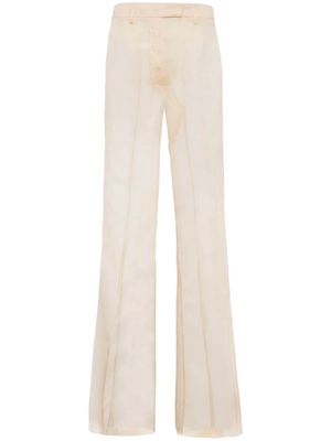 Prada pressed-crease sheer flared trousers - Neutrals