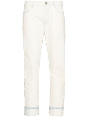 Prada triangle patch mid-rise jeans - White