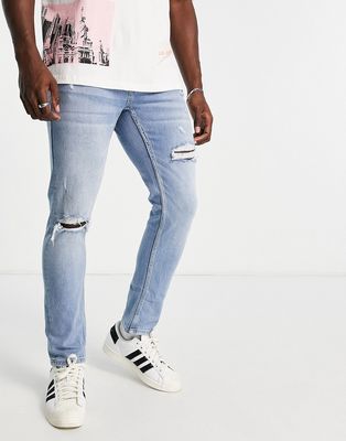 Pull & Bear slim jeans with rips in blue