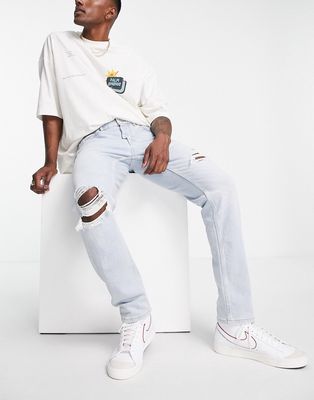 Pull & Bear slim jeans with rips in light blue