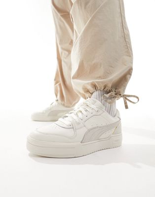 PUMA Cali Pro Lux sneakers in white and beige