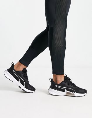 PUMA PowerFrame TR sneakers in black and white