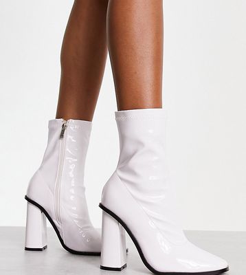 Raid Wide Fit Saylor block heel sock boots in white patent