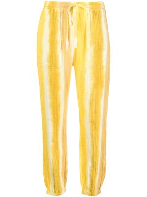 Raquel Allegra crinkled-effect cotton track pants - Yellow