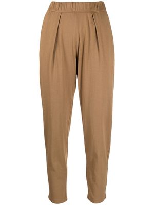 Raquel Allegra pleated cotton tapered trousers - Brown